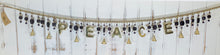 Load image into Gallery viewer, Brass & Beads Word Mobiles